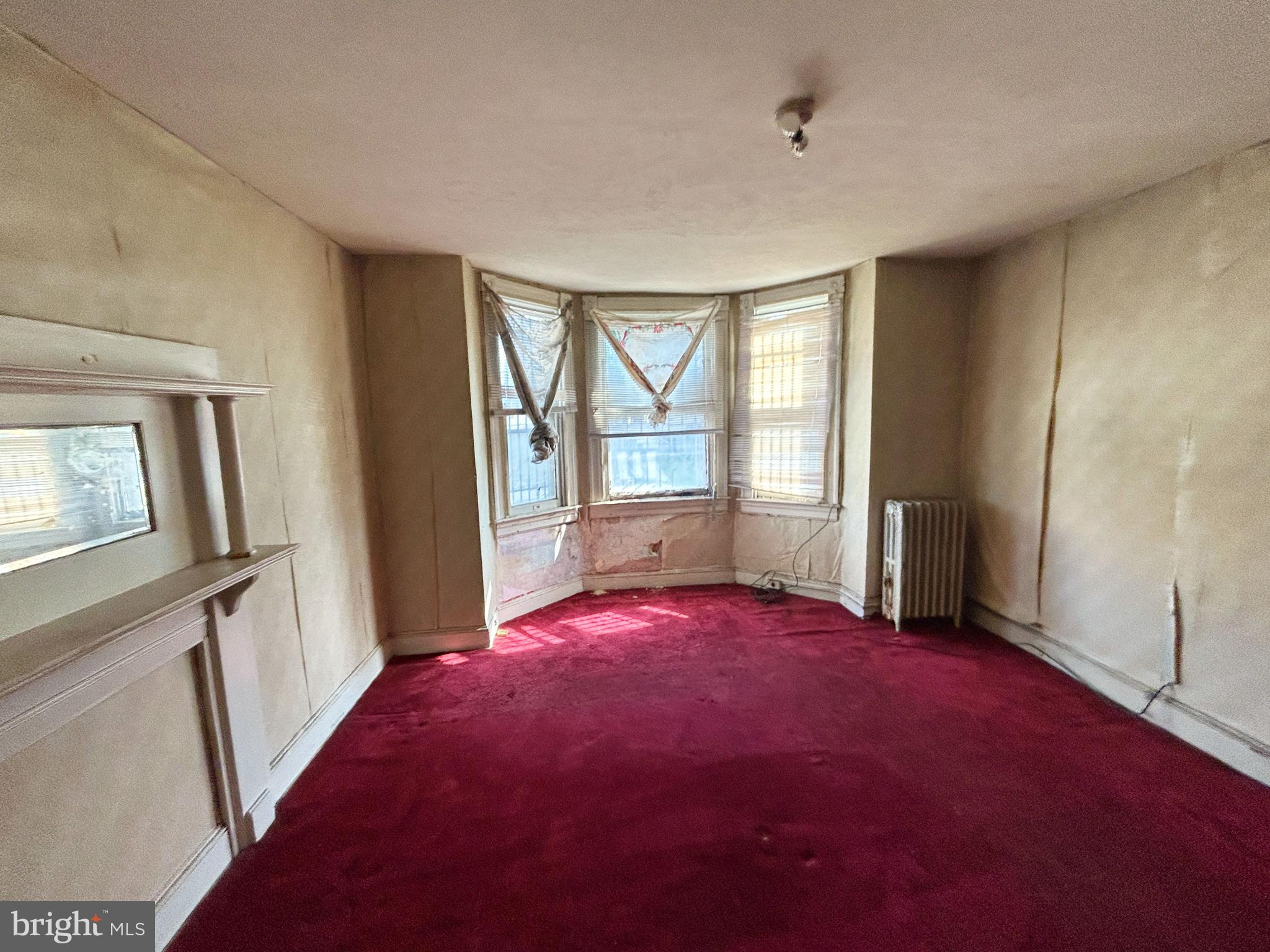 3912 Reisterstown Road Baltimore, MD 21215 - Photo 9 of 13 an empty room with windows