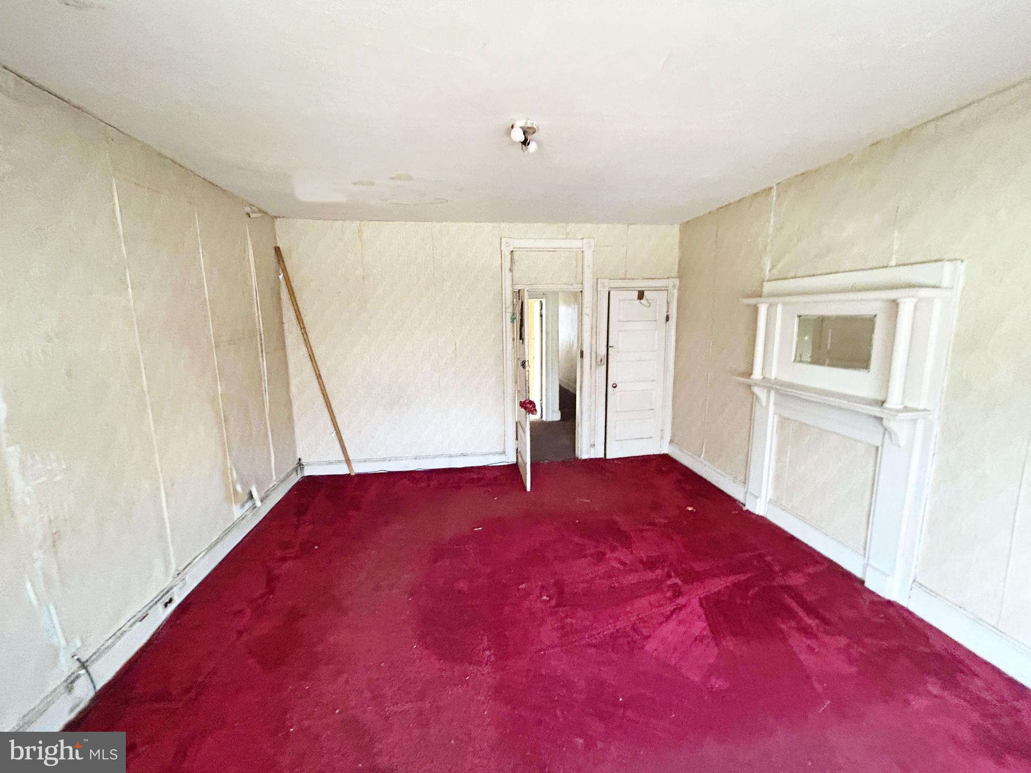 3912 Reisterstown Road Baltimore, MD 21215 - Photo 10 of 13 a view of an empty room with a window