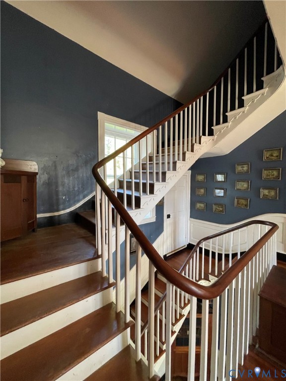 287 Rowes Landing Road Heathsville, VA 22473 - Photo 26 of 60 a view of staircase with lots of frames on wall and a window