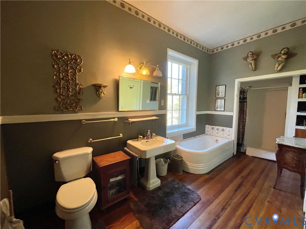 287 Rowes Landing Road Heathsville, VA 22473 - Photo 35 of 60 a bathroom with a toilet a sink and mirror