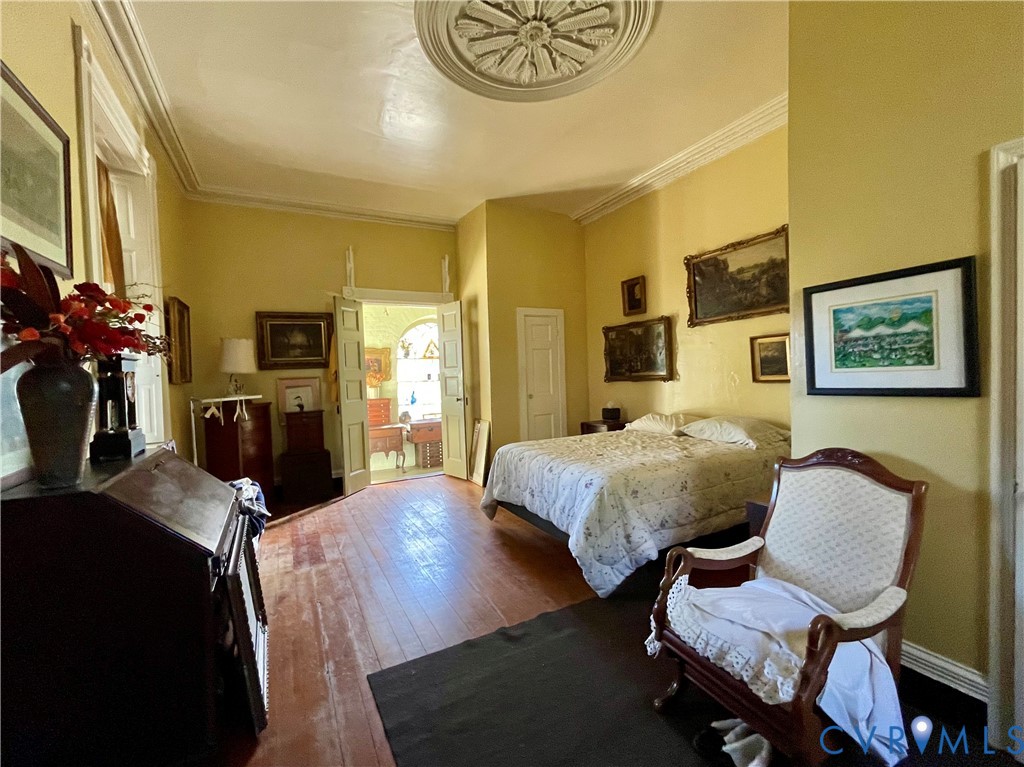 287 Rowes Landing Road Heathsville, VA 22473 - Photo 41 of 60 a bedroom with a bed and wooden floor
