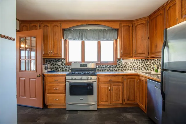 a kitchen with a stove and a sink