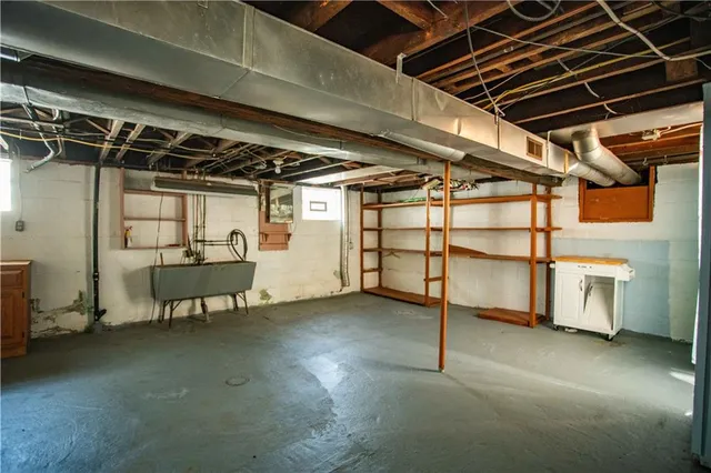 a view of empty room with wooden walls