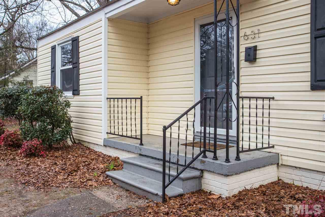 631 Brighton Road Raleigh, NC 27610 - Photo 2 of 25 a view of a house with a small deck and furniture