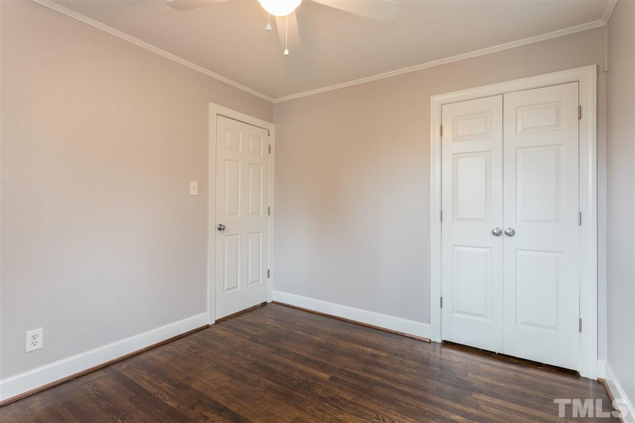 631 Brighton Road Raleigh, NC 27610 - Photo 15 of 25 a view of an empty room with wooden floor