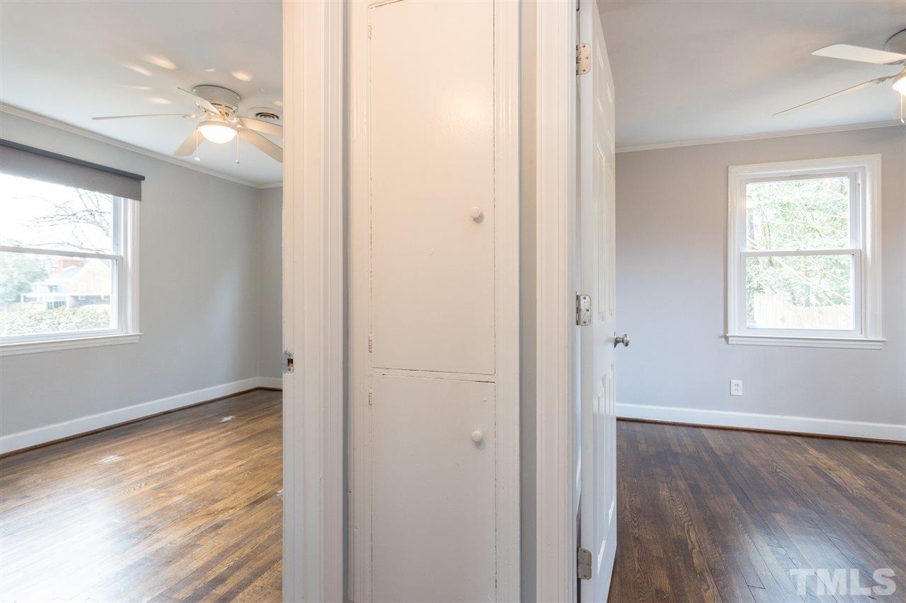 631 Brighton Road Raleigh, NC 27610 - Photo 18 of 25 a view of hallway with windows and wooden floor