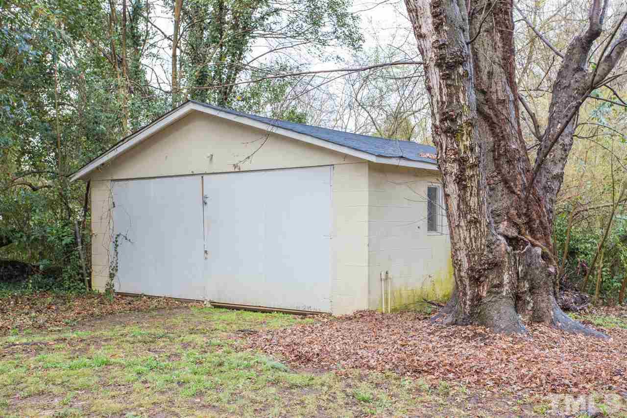 631 Brighton Road Raleigh, NC 27610 - Photo 22 of 25 a house with trees in the background
