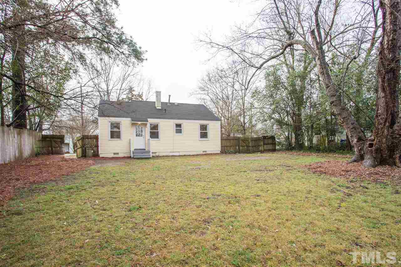 631 Brighton Road Raleigh, NC 27610 - Photo 23 of 25 a house with trees in front of it