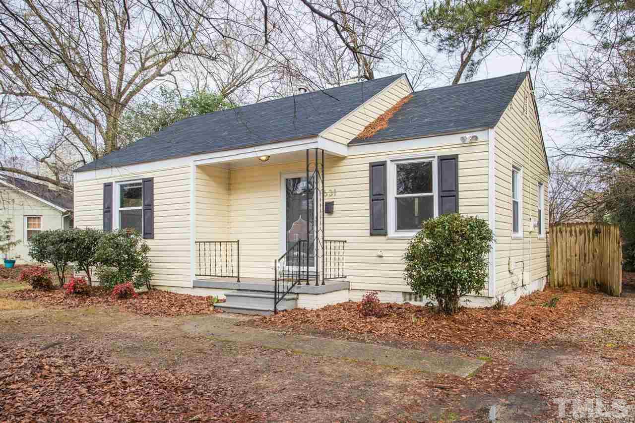 631 Brighton Road Raleigh, NC 27610 - Photo 24 of 25 a front view of a house with a yard and garage