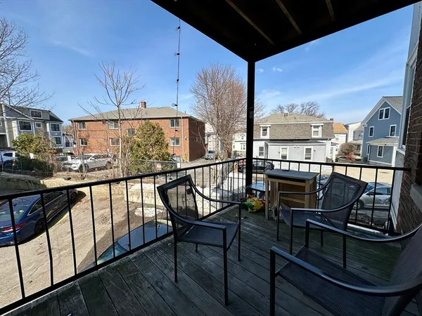 a view of a balcony with chairs