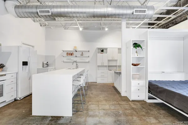 a utility room with cabinets