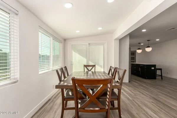 a kitchen with stainless steel appliances a refrigerator a sink and a stove