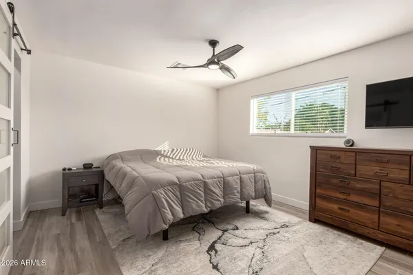 a bedroom with a bed and a walk in closet