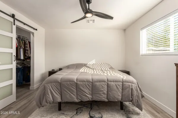 a bedroom with a bed and a walk in closet
