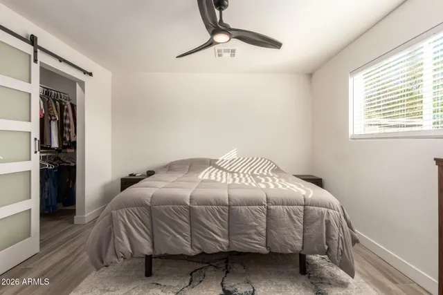 a bedroom with a bed and a walk in closet