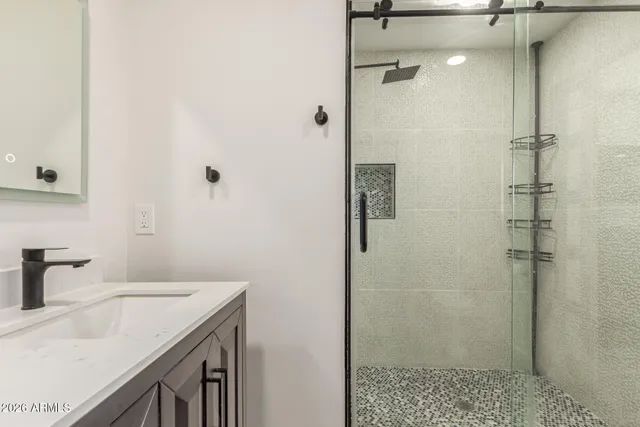 a utility room with sink dryer and washer