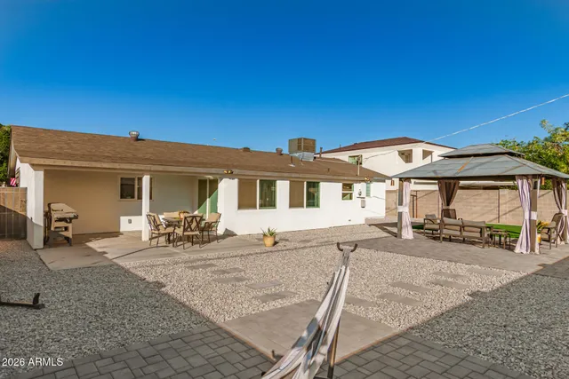 a view of an outdoor space with a table and chairs