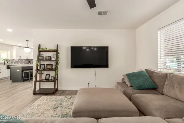 a living room with furniture and a window