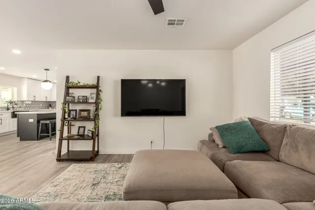 a living room with furniture and a window