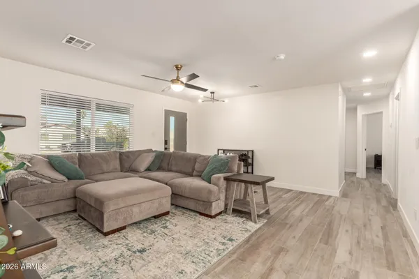 a view of a dining room with furniture and wooden floor