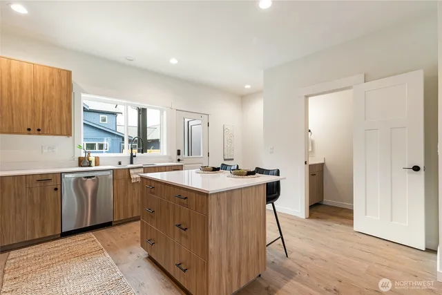 a kitchen with a sink and cabinets