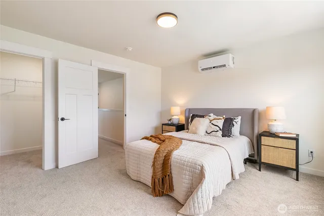 a bedroom with bed and window