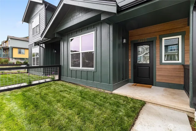 a view of front door of house with yard