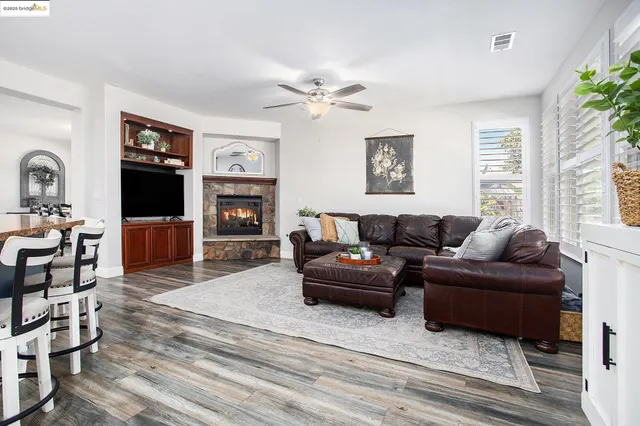 a kitchen with a sink cabinets and wooden floor