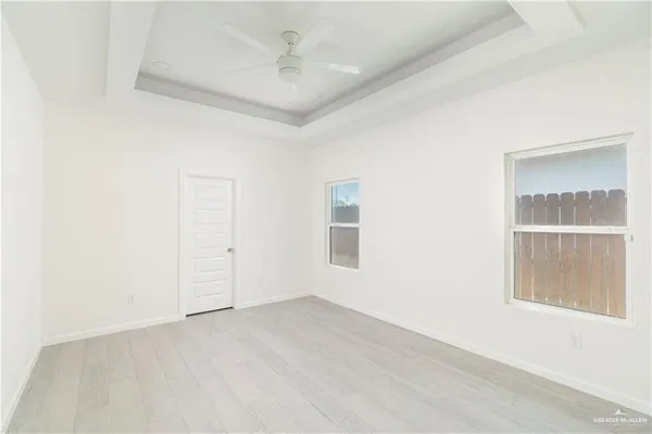 an empty room with a empty space and windows