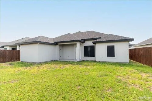 a view of a house with a yard and garage