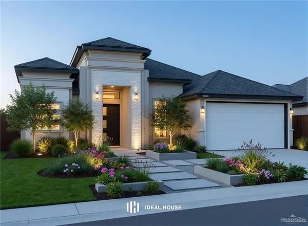 a front view of a house with a garden