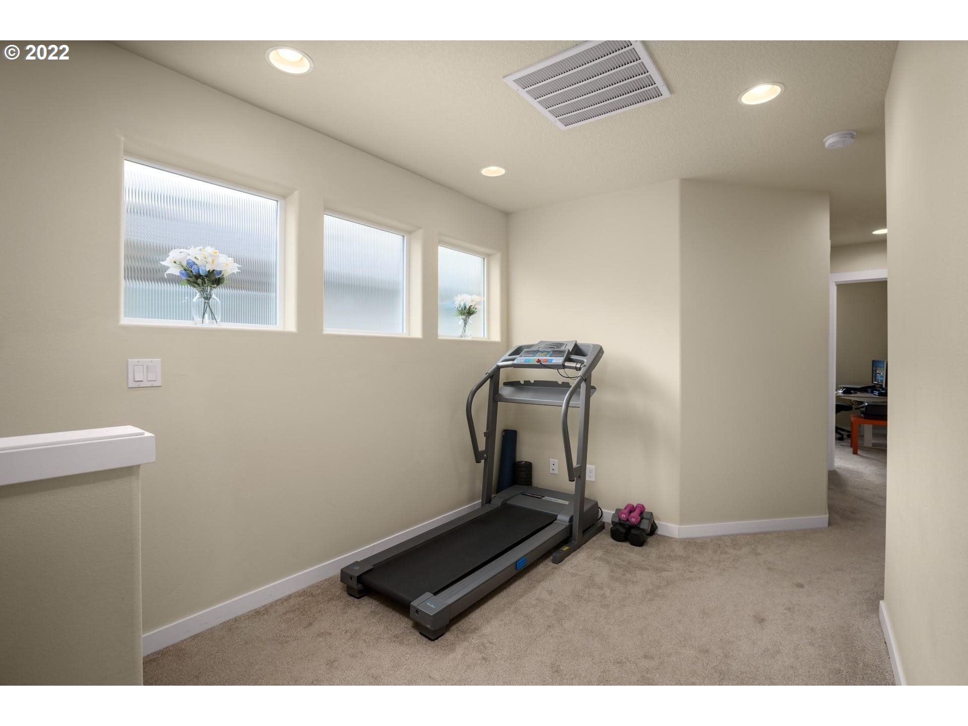 374 Southwest 202nd Terrace Beaverton, OR 97006 - Photo 18 of 28 a room with gym equipment