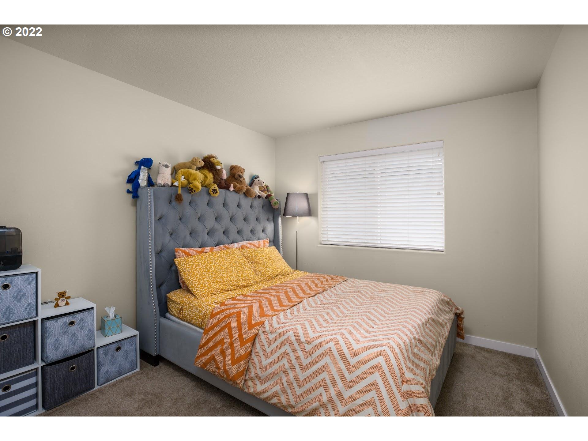 374 Southwest 202nd Terrace Beaverton, OR 97006 - Photo 21 of 28 a bedroom with a bed and with tv