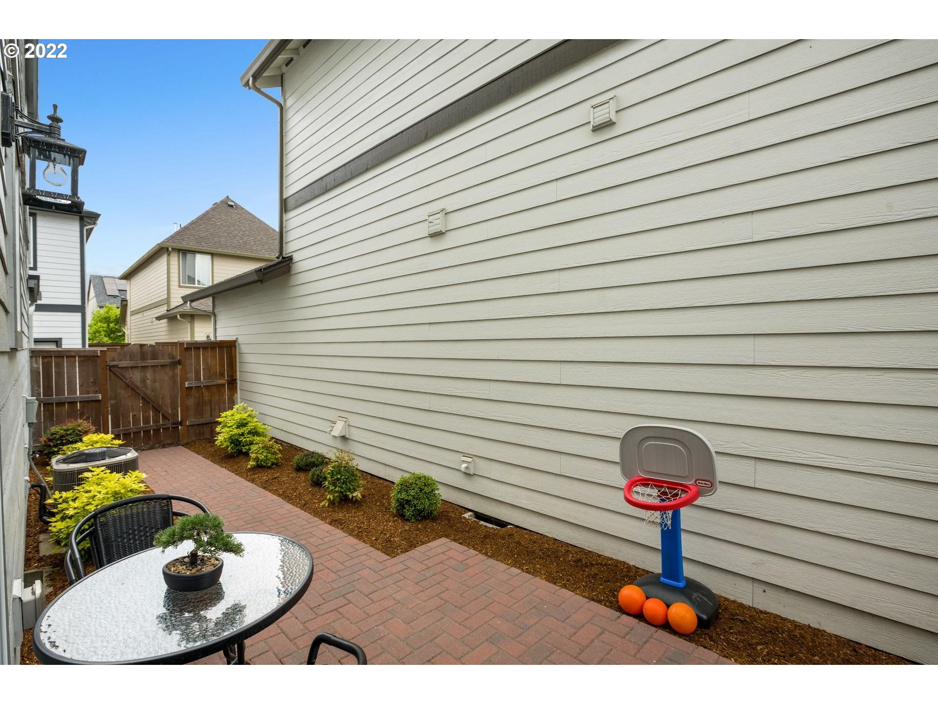 374 Southwest 202nd Terrace Beaverton, OR 97006 - Photo 25 of 28 a backyard of a house with seating space