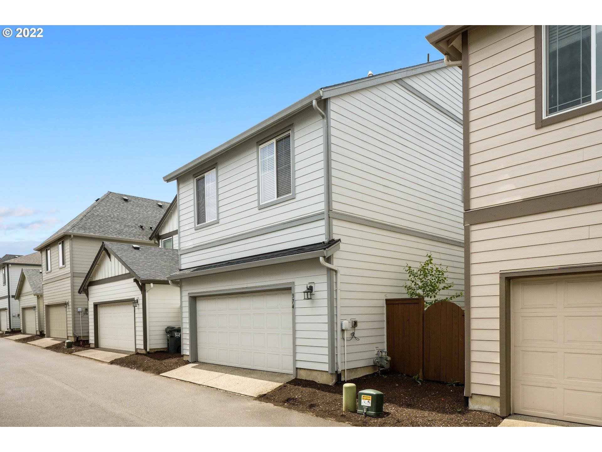 374 Southwest 202nd Terrace Beaverton, OR 97006 - Photo 26 of 28 a view of a house with a backyard