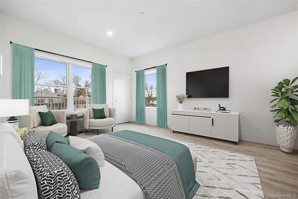 a spacious bathroom with a sink and a window