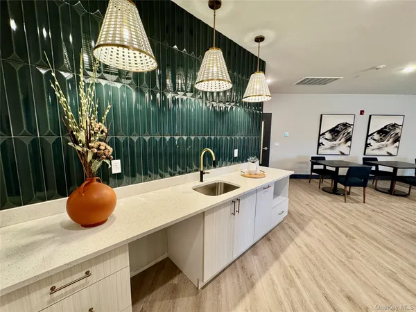 a living room with furniture wooden floor and a fireplace