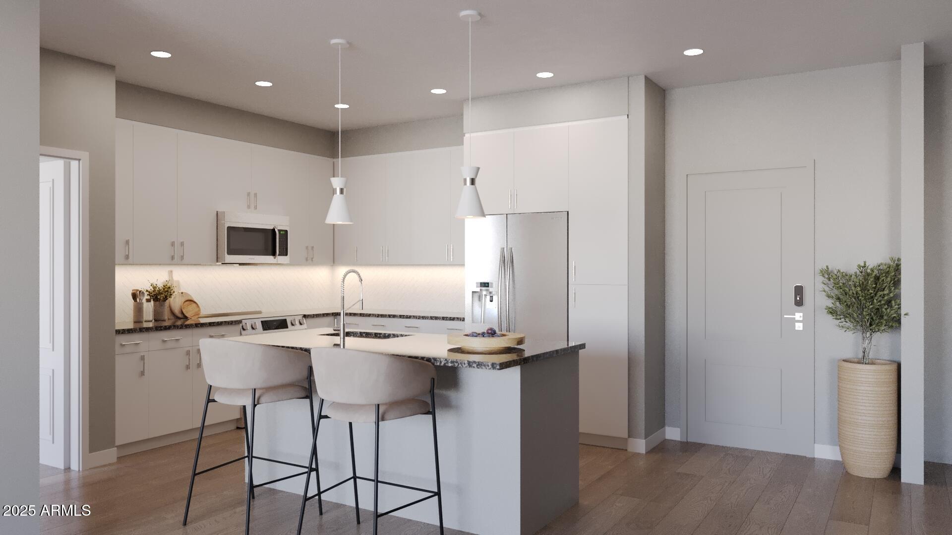 2375 West Frye Road, Unit 1 Chandler, AZ 85224 - Photo 2 of 18 a kitchen with stainless steel appliances kitchen island granite countertop a refrigerator and a stove top oven with wooden floor