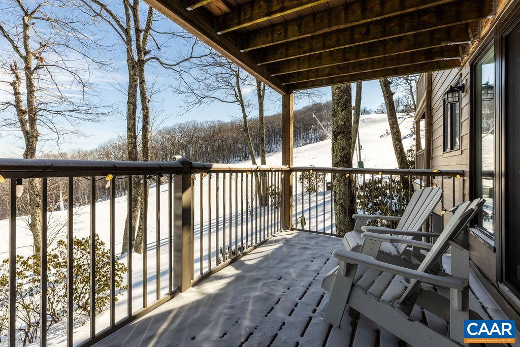 a view of a porch with wooden floor