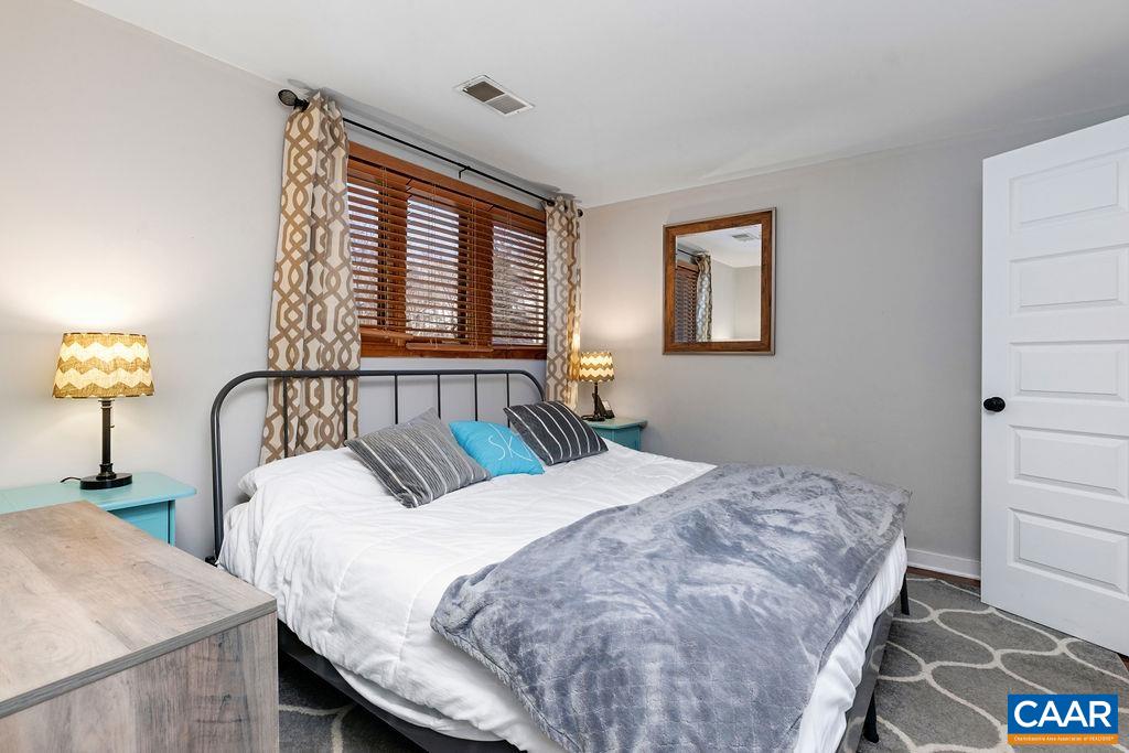 105 Eagles Court Wintergreen, VA 22967 - Photo 15 of 47 a bedroom with double bed and a window