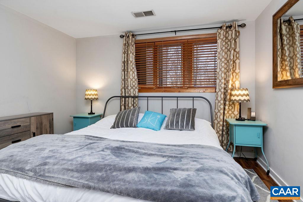 105 Eagles Court Wintergreen, VA 22967 - Photo 16 of 47 a bedroom with a large bed and a window