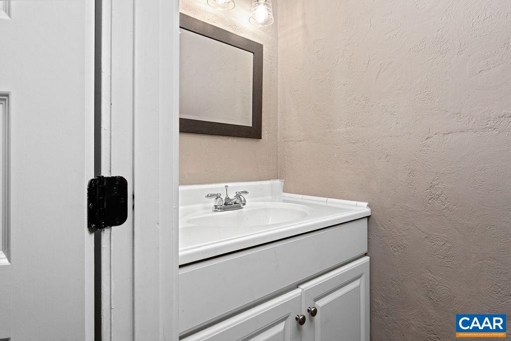 105 Eagles Court Wintergreen, VA 22967 - Photo 18 of 47 a bathroom with a sink and a mirror