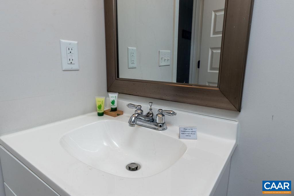 105 Eagles Court Wintergreen, VA 22967 - Photo 22 of 47 a bathroom with a sink and a mirror