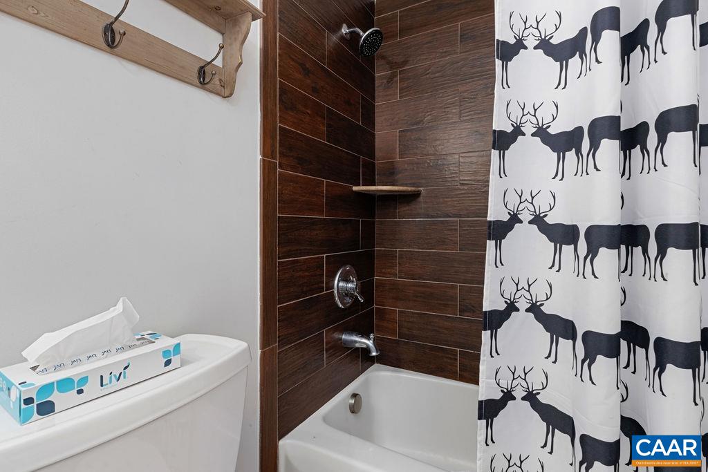 105 Eagles Court Wintergreen, VA 22967 - Photo 23 of 47 a bathroom with a bathtub and shower