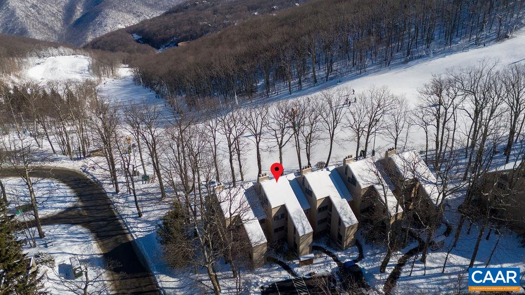 105 Eagles Court Wintergreen, VA 22967 - Photo 28 of 47 a view of walk in closet with clothes and trees