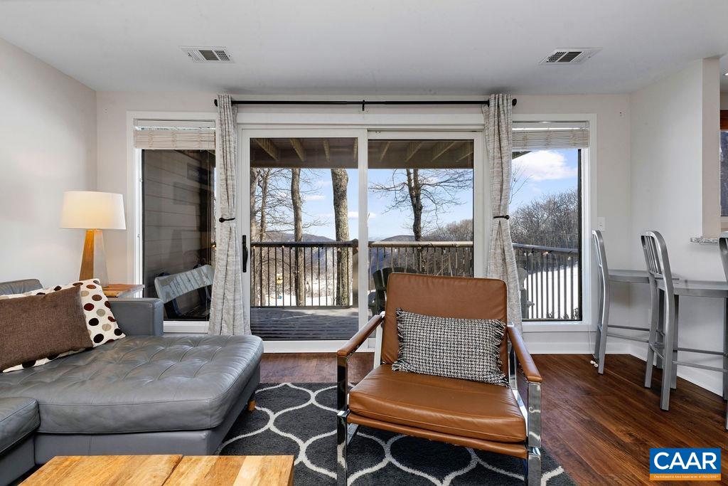 105 Eagles Court Wintergreen, VA 22967 - Photo 6 of 47 a living room with furniture and a window
