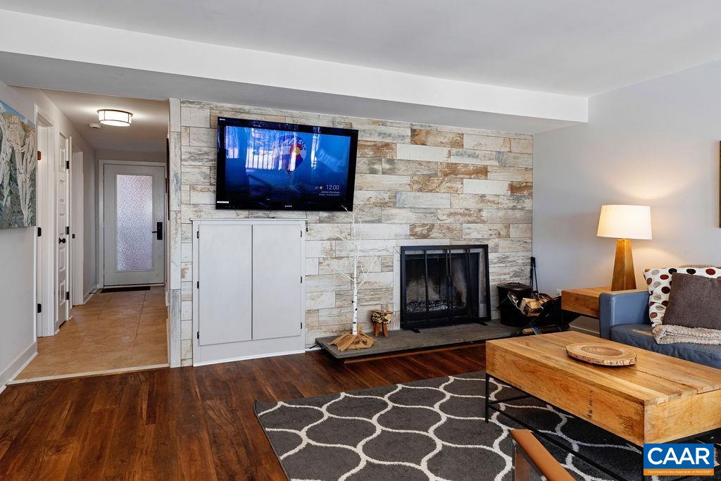 105 Eagles Court Wintergreen, VA 22967 - Photo 8 of 47 a living room with furniture and a fireplace
