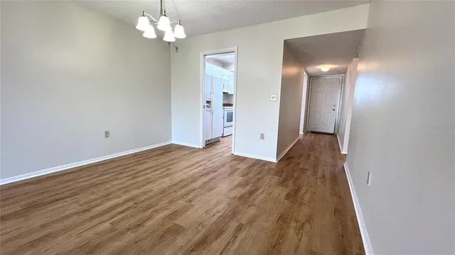 a view of a livingroom with wooden floor