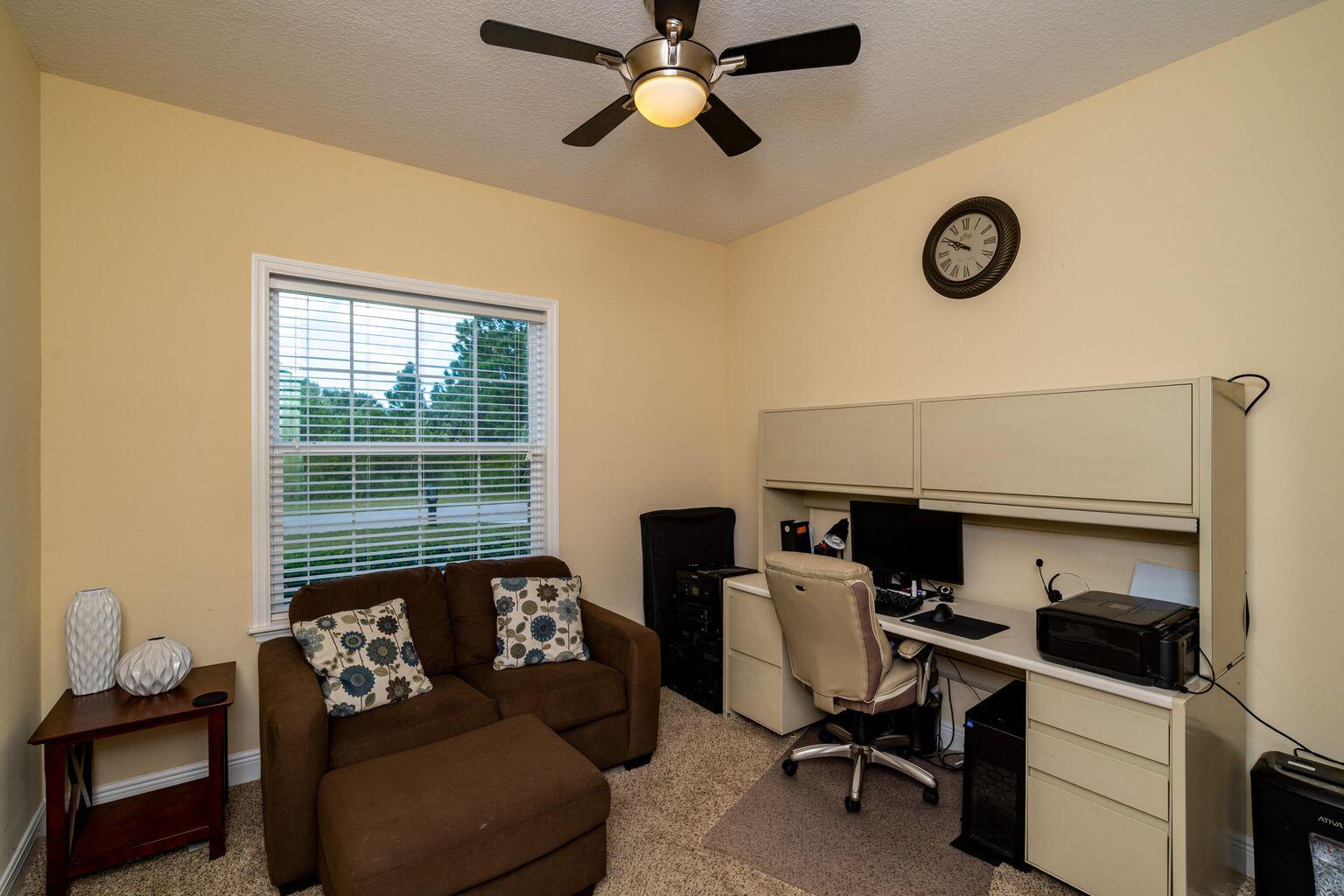 1026 Southwest Ingrassina Avenue Port St. Lucie, FL 34953 - Photo 17 of 20 a work room with furniture and a window