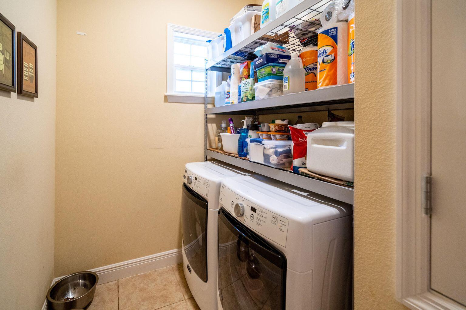 1026 Southwest Ingrassina Avenue Port St. Lucie, FL 34953 - Photo 10 of 20 a utility room with dryer and washer